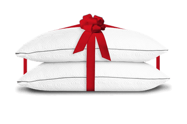 Adjustable Pillow stack with a red bow around it